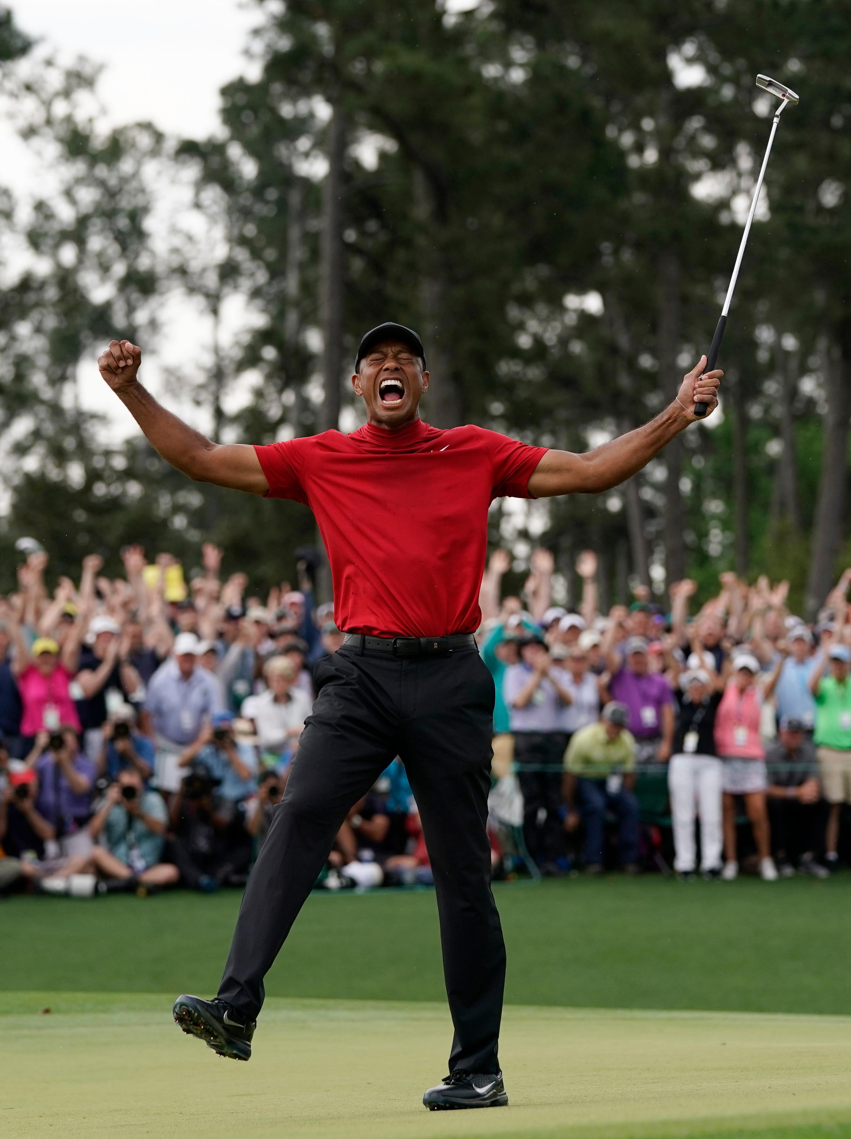 tiger woods reacts as he wins the masters golf tournament sunday